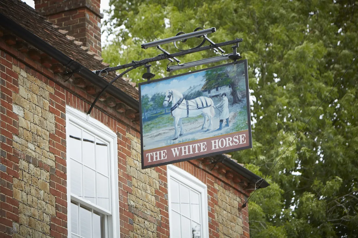 The White Horse pub sign. 